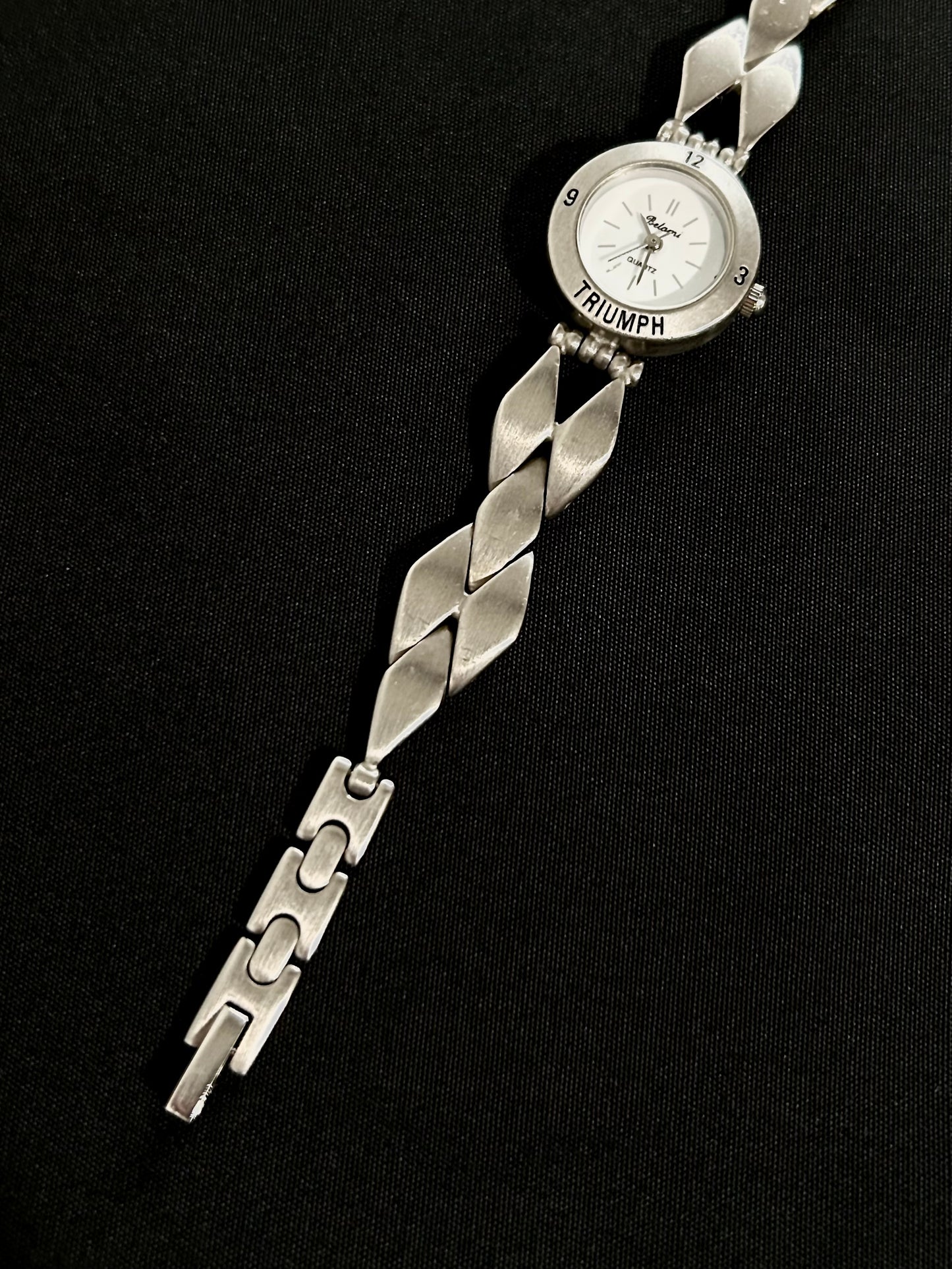 diamond shaped belt watch