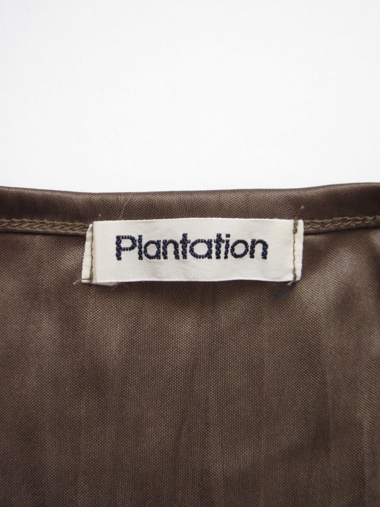 Plantation shiny brown top