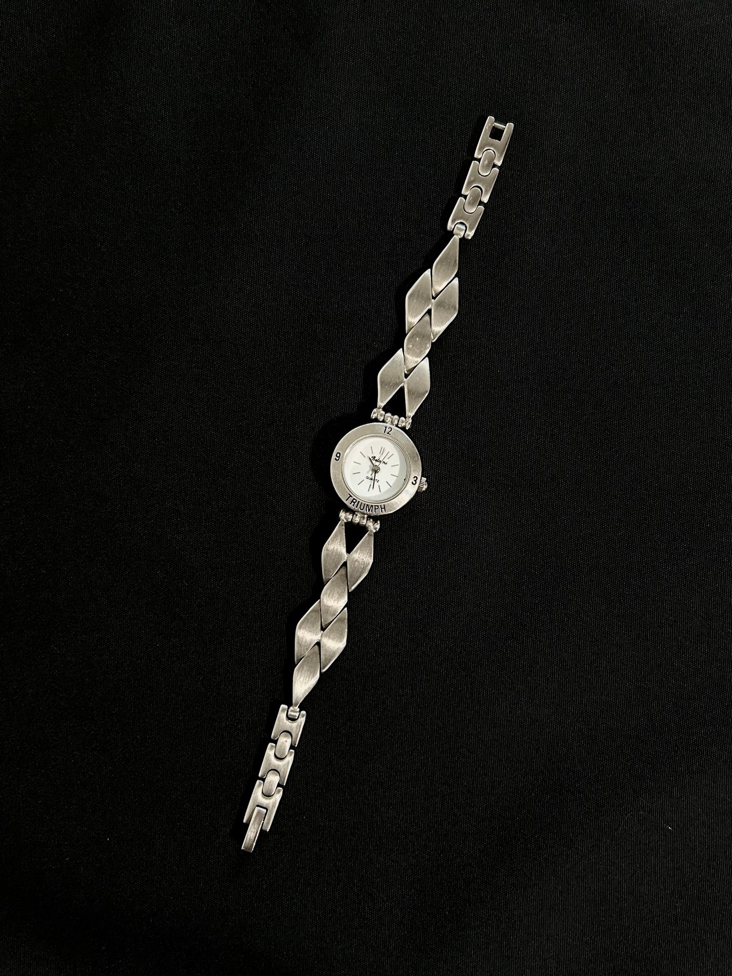 diamond shaped belt watch